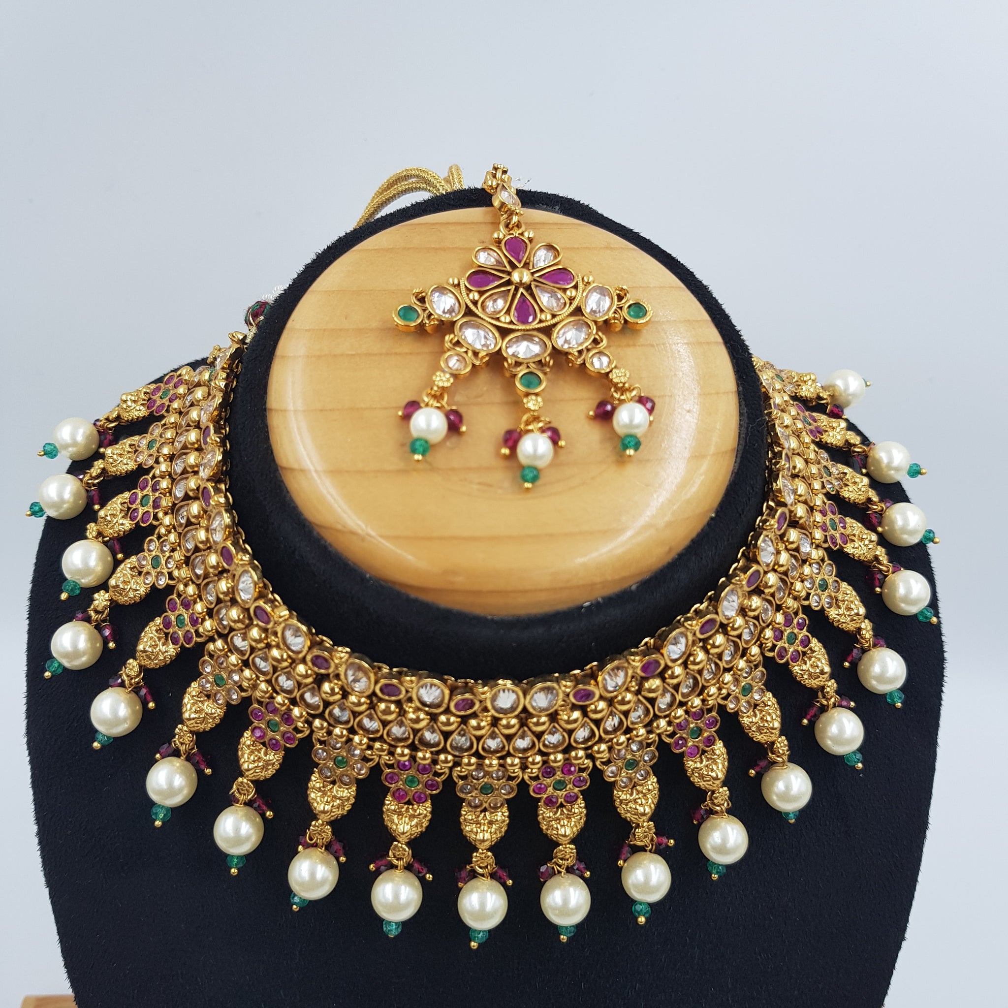 Polki Choker Set With Ruby Green Emerald Stones